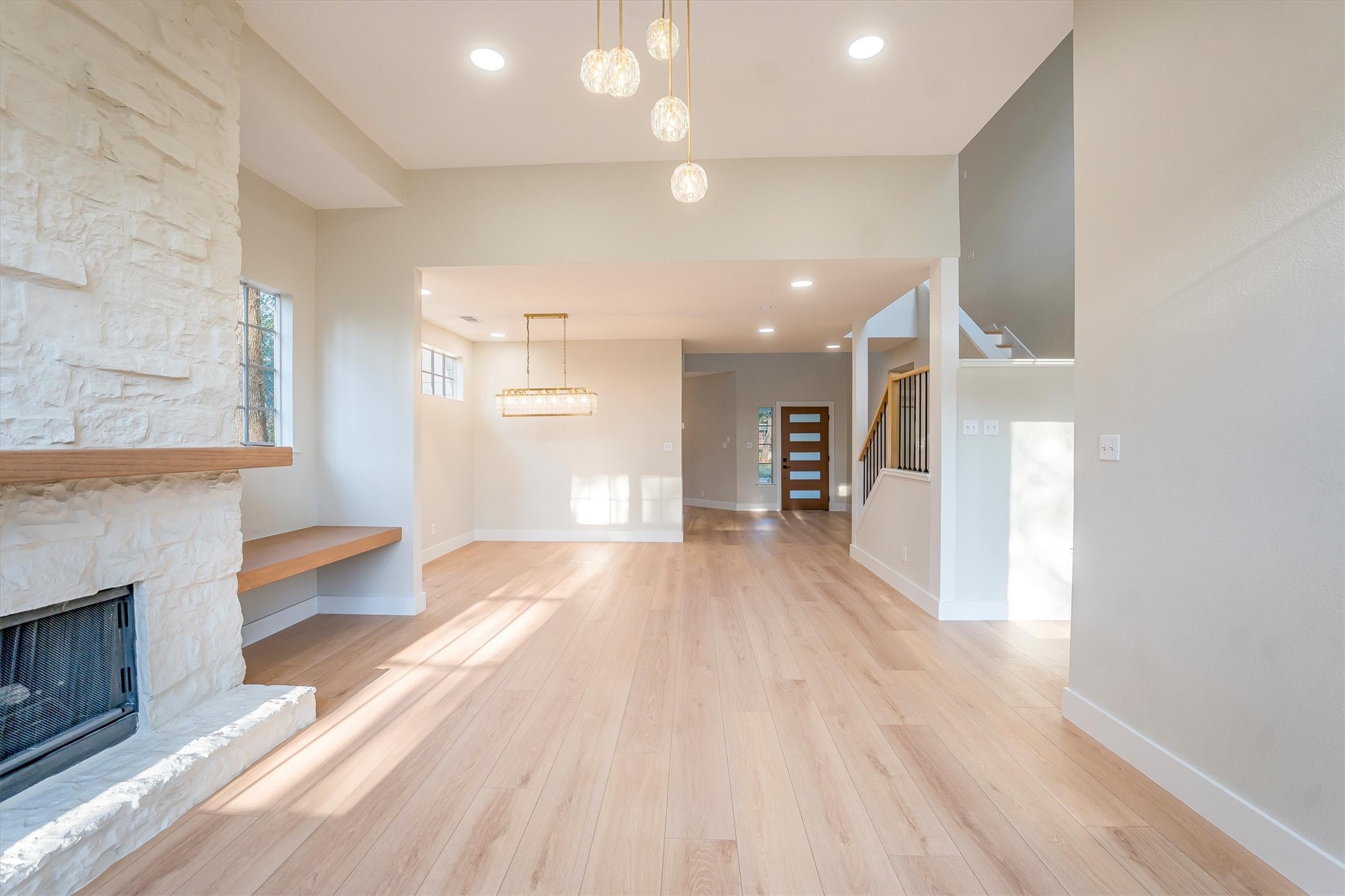 235 South Crimson Clover Circle Spring, TX 77381 - Photo 13 of 22 a view of a living room kitchen with a sink and a fireplace