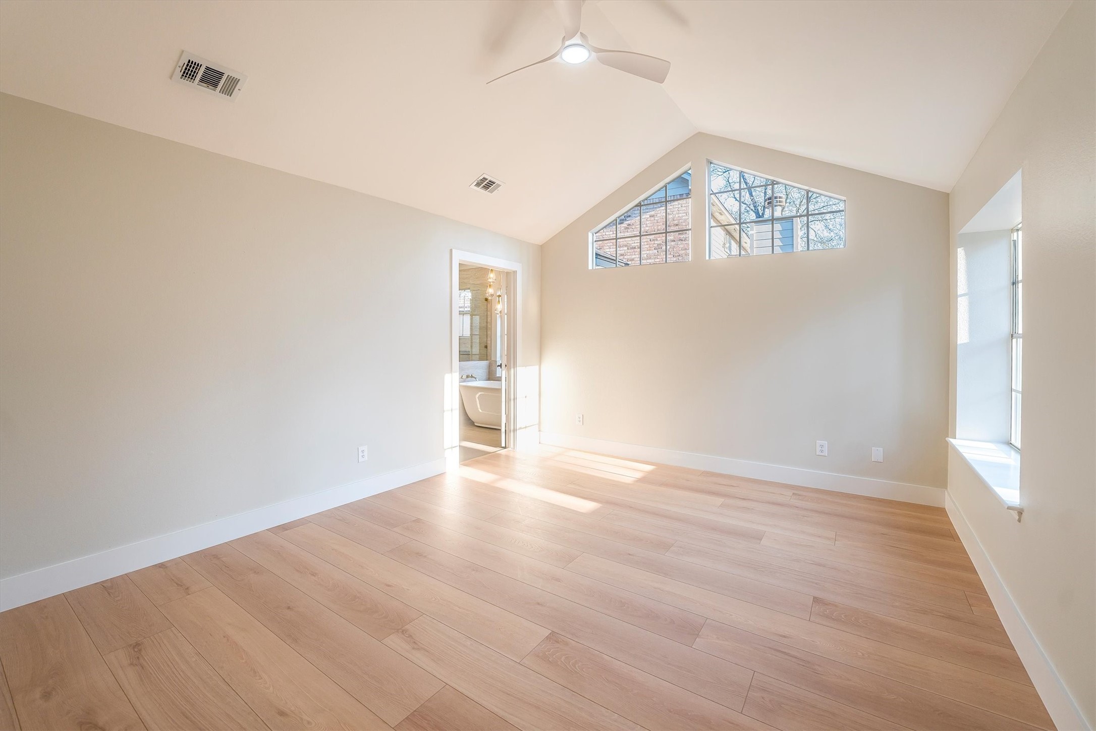 235 South Crimson Clover Circle Spring, TX 77381 - Photo 14 of 22 wooden floor in an empty room with a window