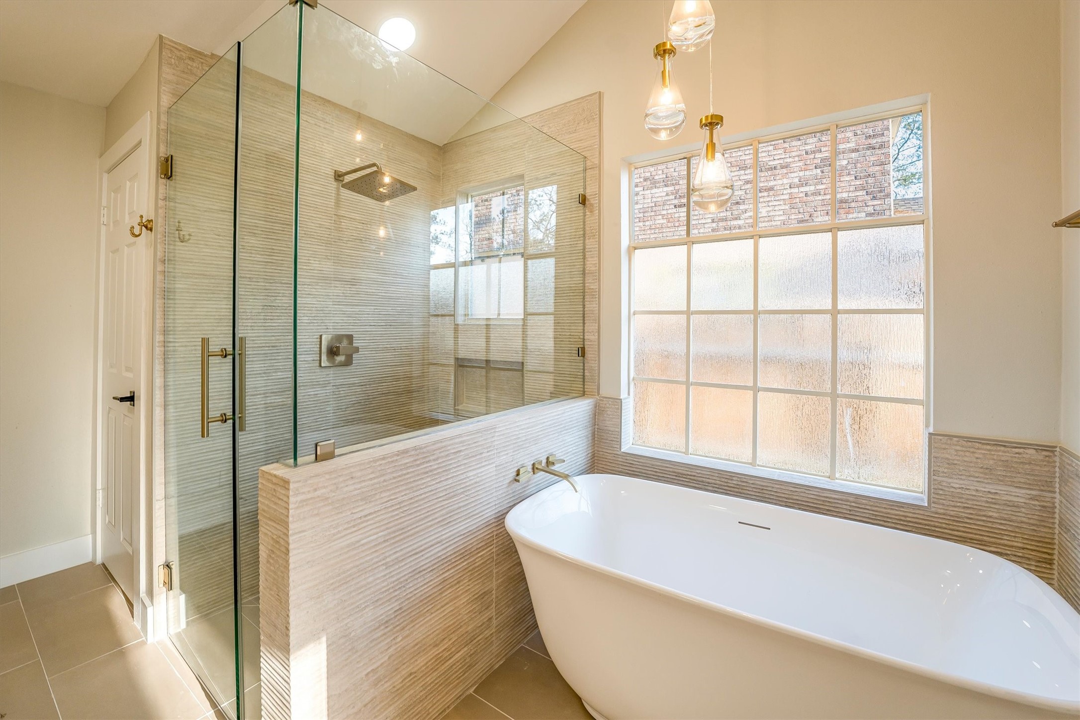 235 South Crimson Clover Circle Spring, TX 77381 - Photo 16 of 22 a bathroom with a bathtub and shower