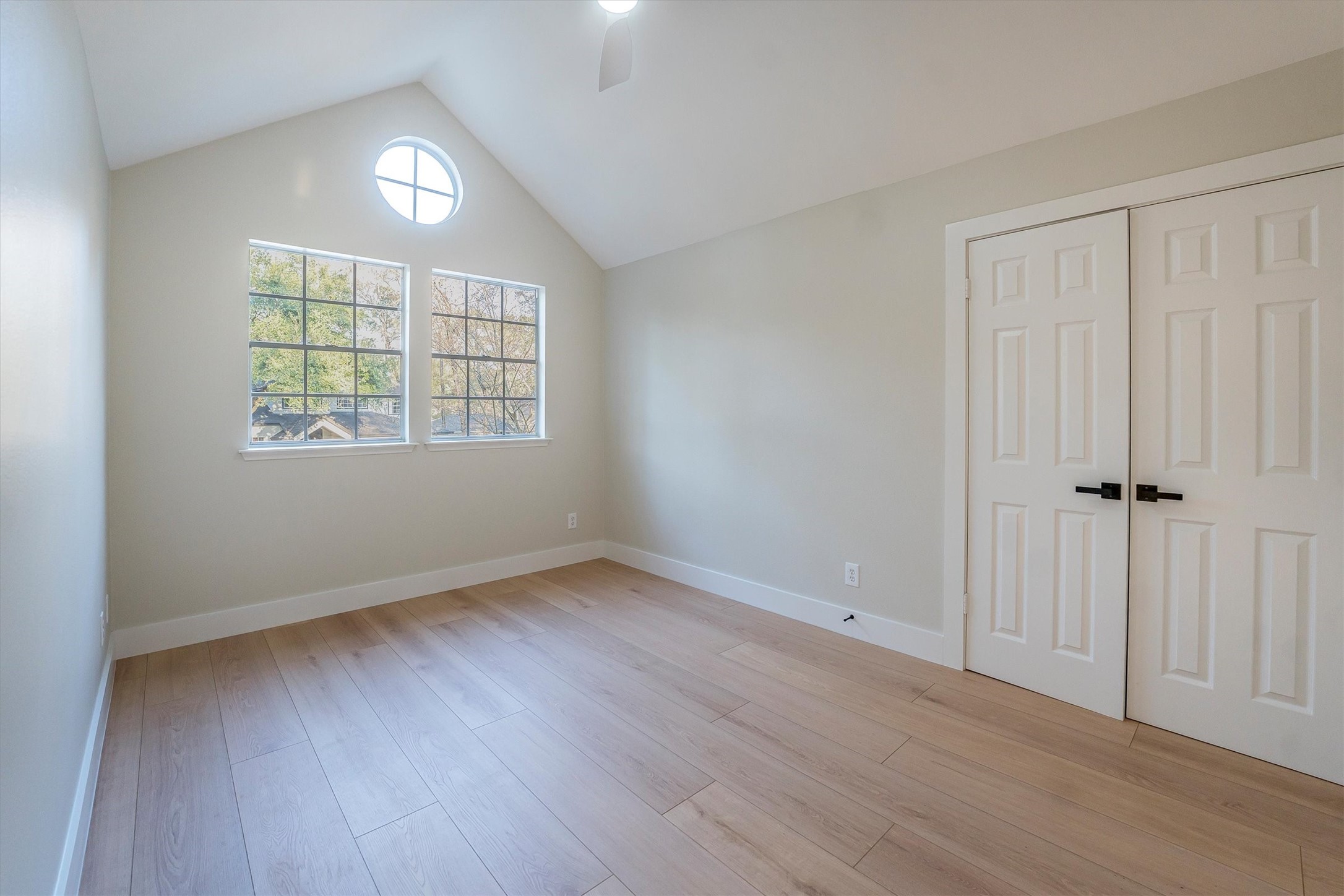 235 South Crimson Clover Circle Spring, TX 77381 - Photo 18 of 22 an empty room with wooden floor and windows