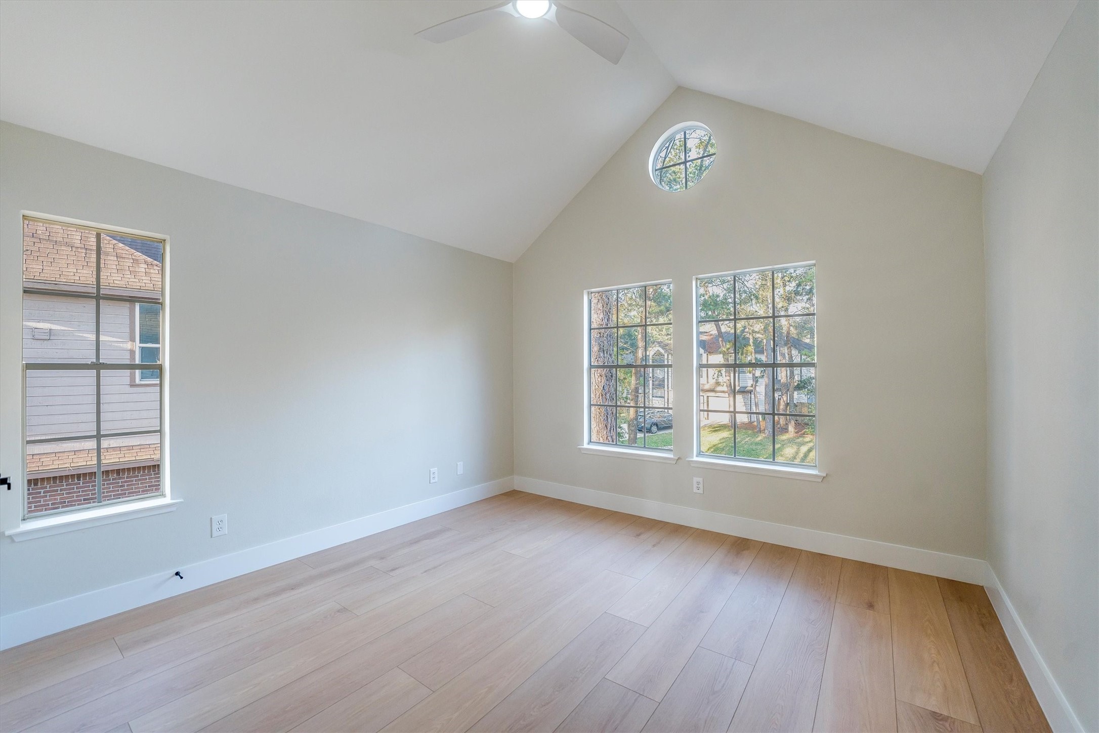 235 South Crimson Clover Circle Spring, TX 77381 - Photo 20 of 22 a view of an empty room with a window and wooden floor