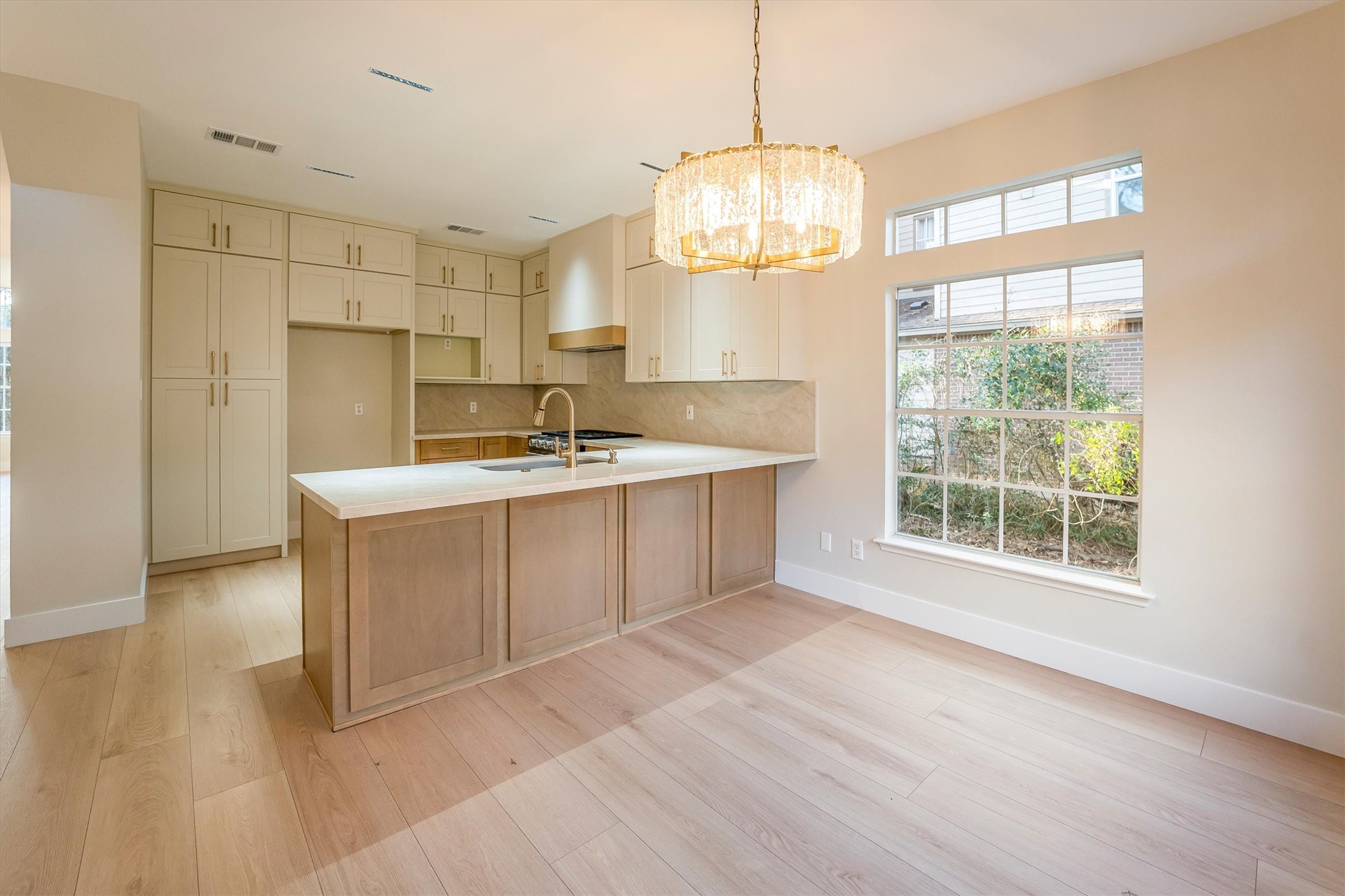 235 South Crimson Clover Circle Spring, TX 77381 - Photo 6 of 22 a kitchen with a sink a counter top space and stainless steel appliances