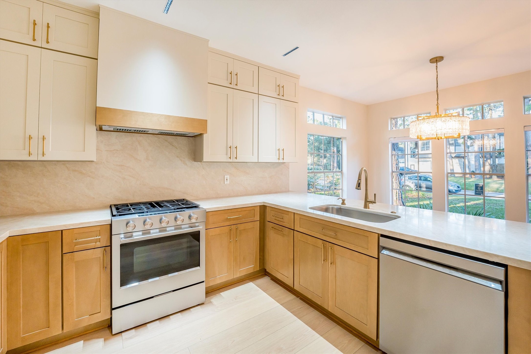 235 South Crimson Clover Circle Spring, TX 77381 - Photo 7 of 22 a kitchen with a sink stove and cabinets