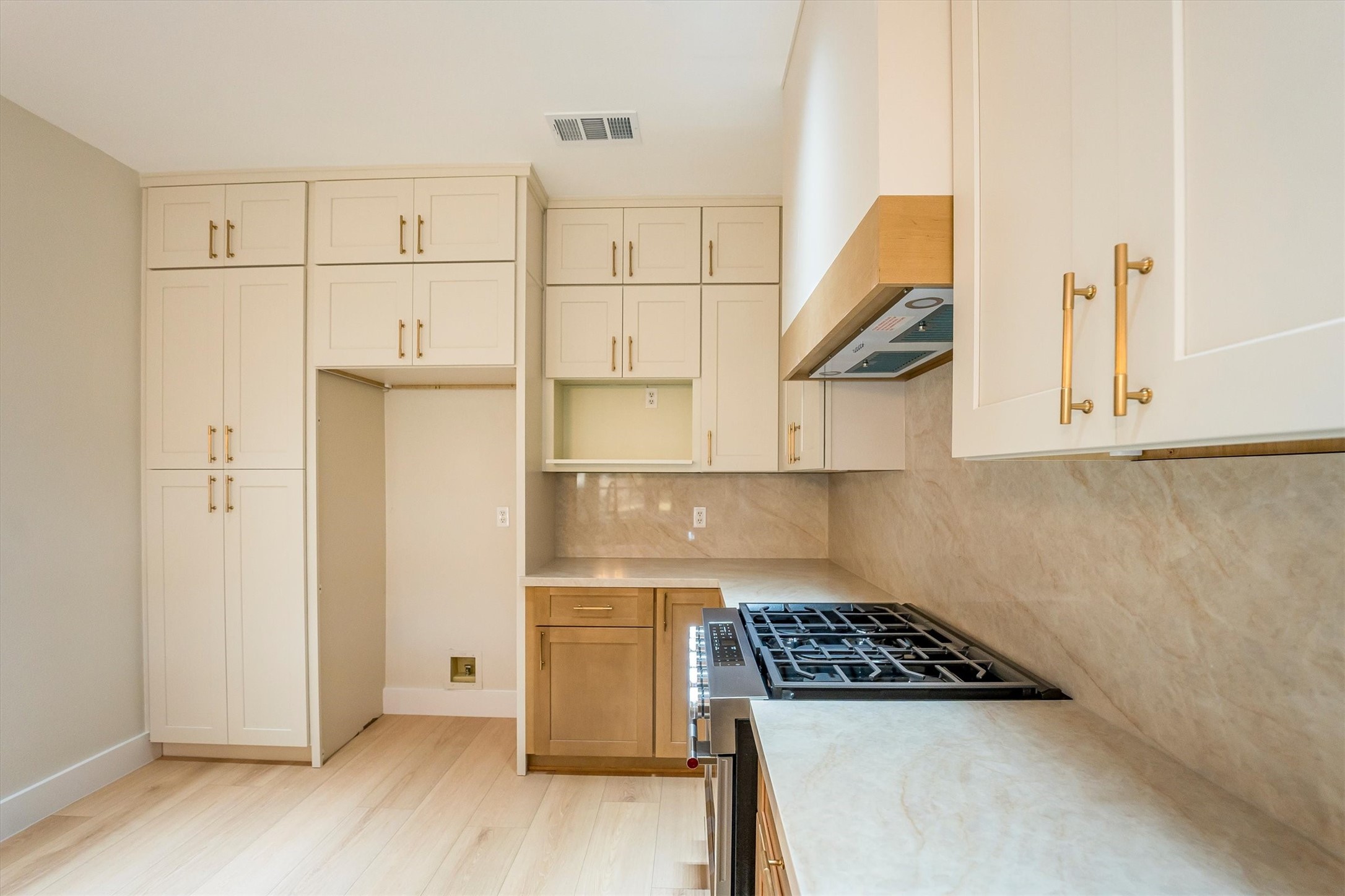 235 South Crimson Clover Circle Spring, TX 77381 - Photo 9 of 22 a kitchen with a refrigerator and a stove top oven