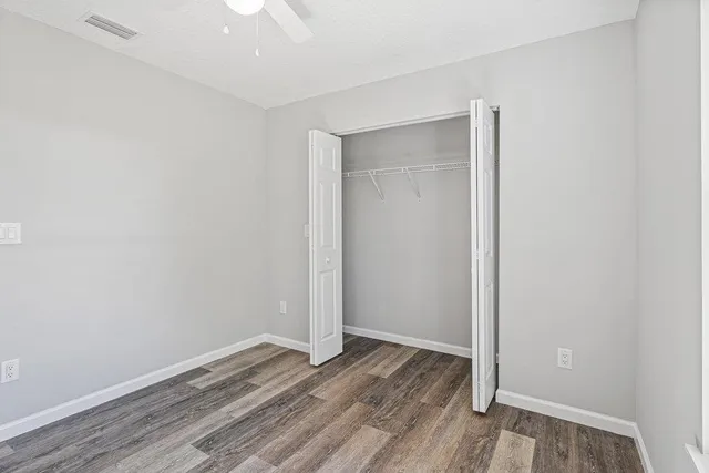 a view of room with wooden floor