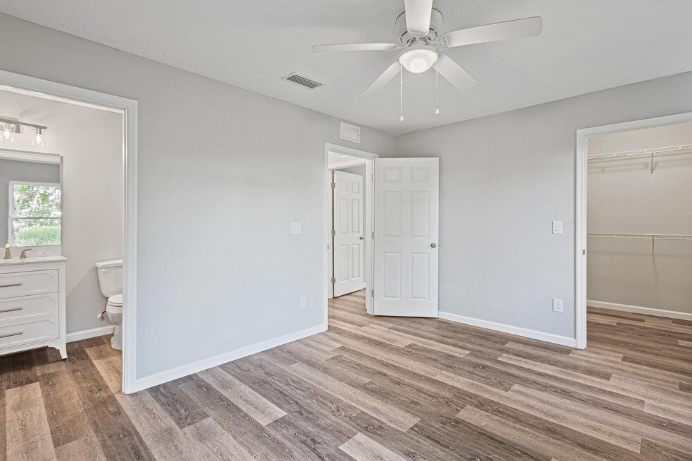 2885 North 8th Street St. Augustine, FL 32084 - Photo 21 of 35 wooden floor in an empty room with a window