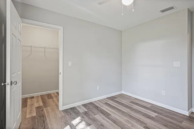a view of room with wooden floor
