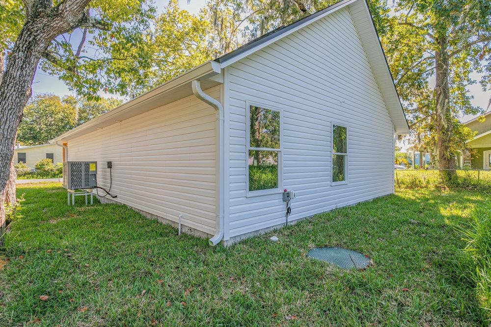 2885 North 8th Street St. Augustine, FL 32084 - Photo 28 of 35 a view of a backyard with plants and large tree