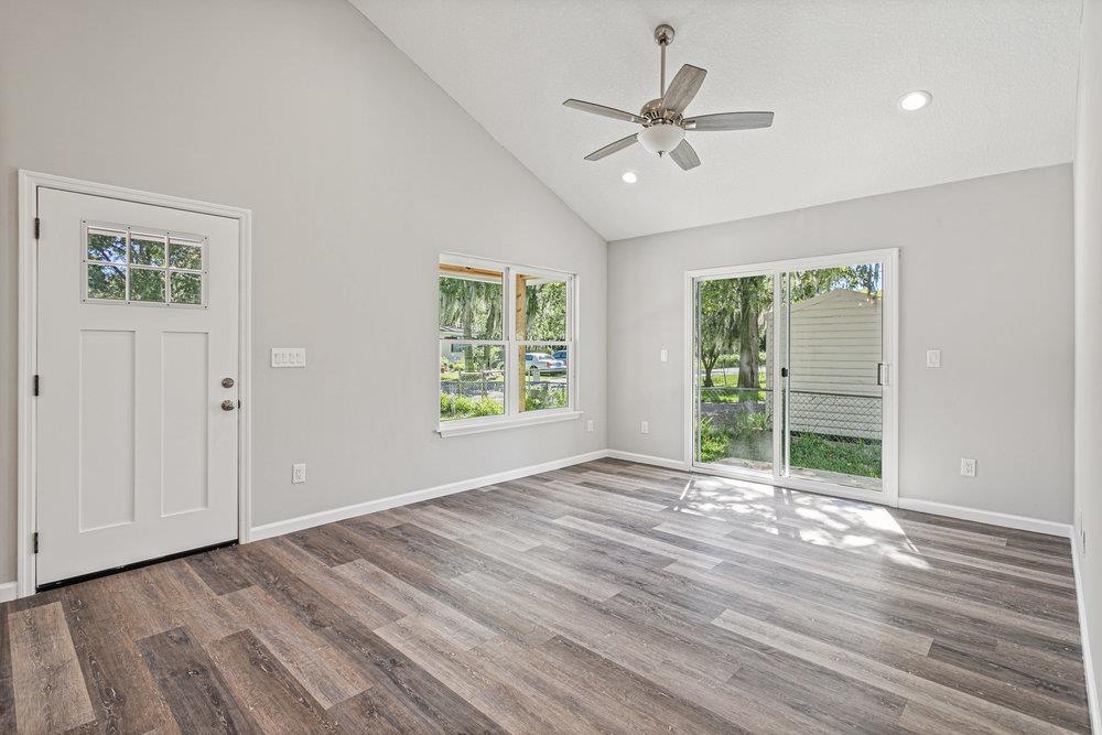 2885 North 8th Street St. Augustine, FL 32084 - Photo 29 of 35 a view of an empty room with a window and wooden floor