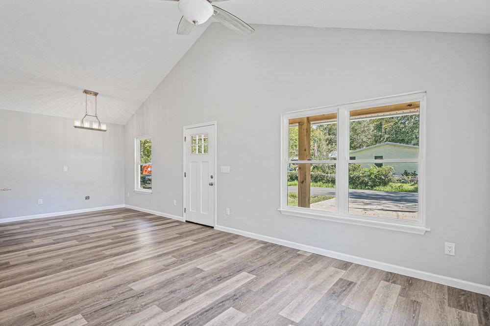 2885 North 8th Street St. Augustine, FL 32084 - Photo 35 of 35 a view of an empty room with wooden floor and a window