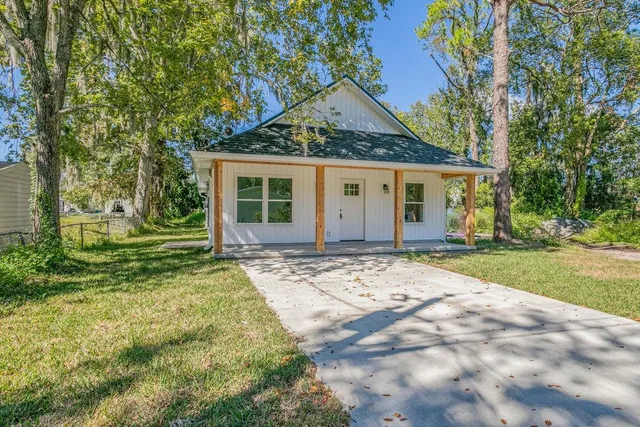 front view of a house with a yard