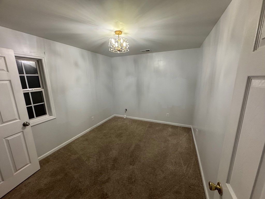950 Ballewtown Road Blue Ridge, GA 30513 - Photo 3 of 12 wooden floor in an empty room with a window