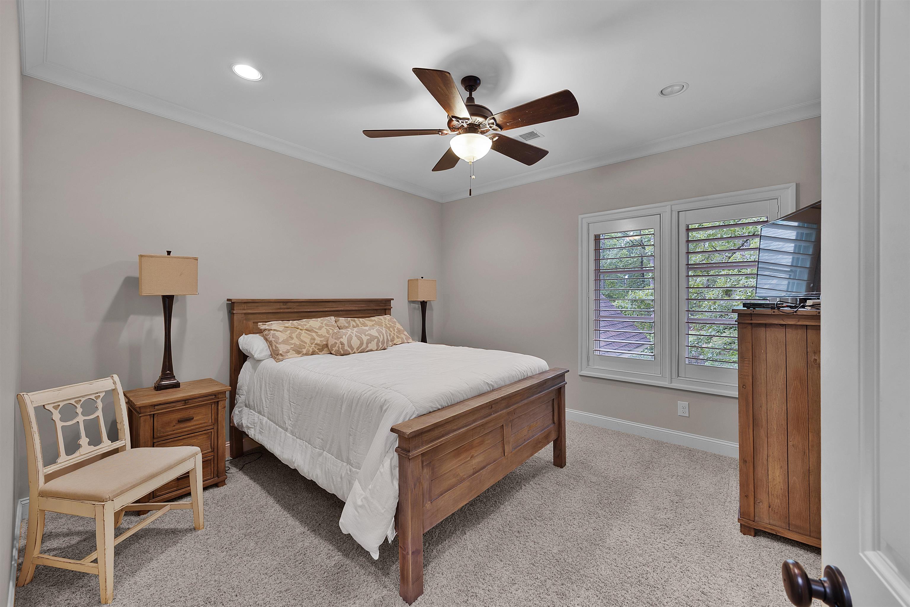 25 Caney Hollow Road Counce, TN 38326 - Photo 22 of 40 Bedroom featuring light carpet, baseboards, ornamental molding, recessed lighting, and a ceiling fan
