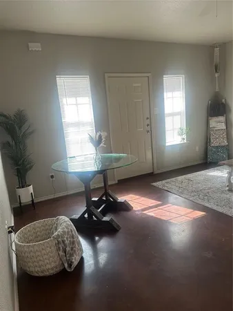 a room with furniture and a window