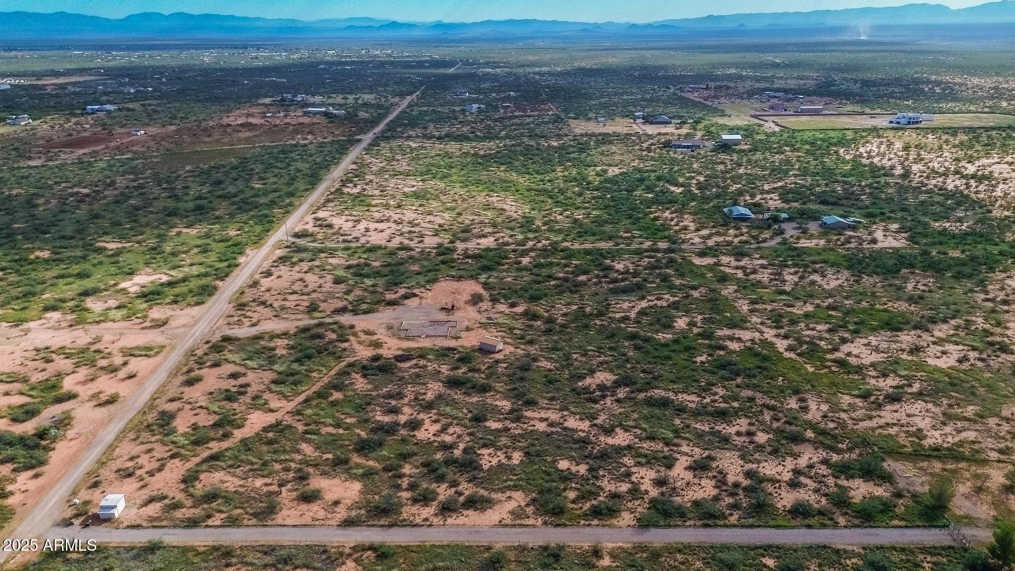 988 West El Rancho Boulevard, Unit B Huachuca City, AZ 85616 - Photo 2 of 13 a view of a yard with wooden floor