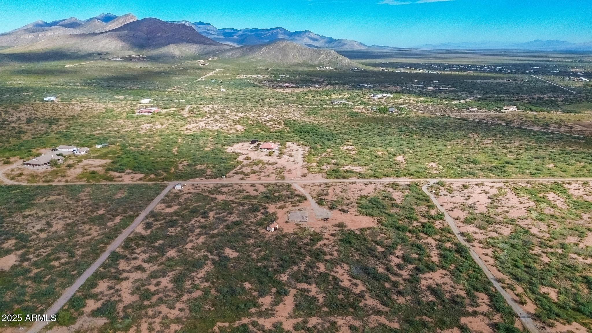 988 West El Rancho Boulevard, Unit B Huachuca City, AZ 85616 - Photo 3 of 13 a view of lake with mountain