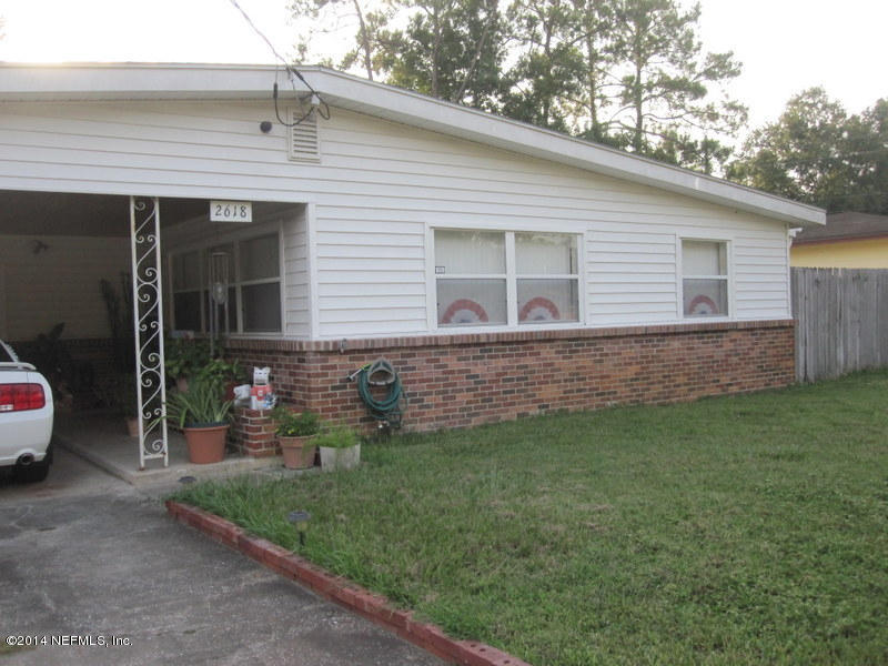 2618 Sam Road Jacksonville, FL 32216 - Photo 14 of 16 a view of a house with a backyard