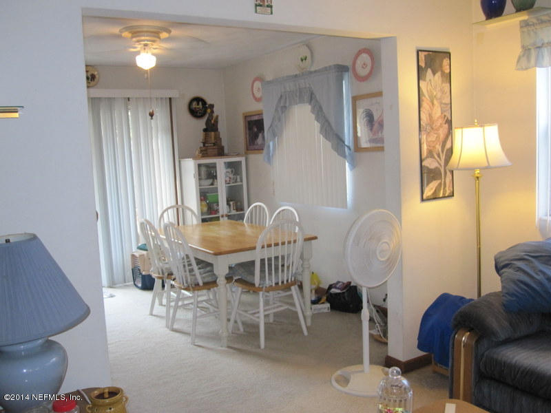2618 Sam Road Jacksonville, FL 32216 - Photo 6 of 16 a view of a livingroom with furniture and wooden floor