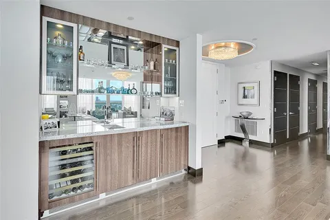 a bathroom with a sink a mirror and a shower