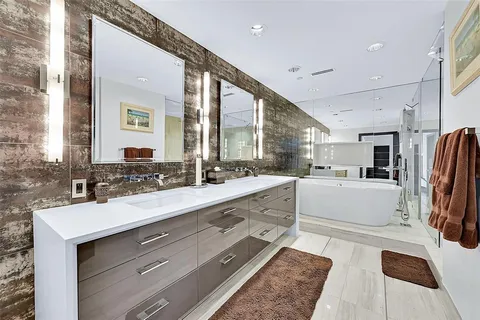 a large white kitchen with a large window