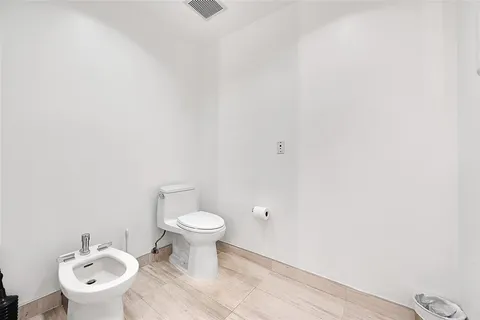 a bathroom with a sink and a toilet