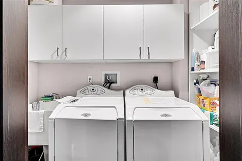 a utility room with dryer and washer