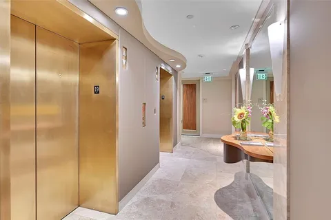 a room with a mirror and furniture