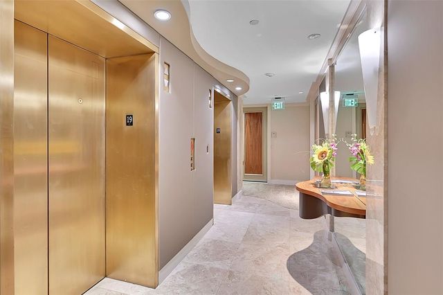 a room with a mirror and furniture