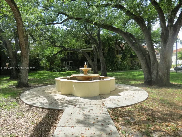 a view of a swimming pool with a backyard
