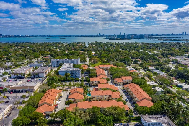 an aerial view of residential building and lake