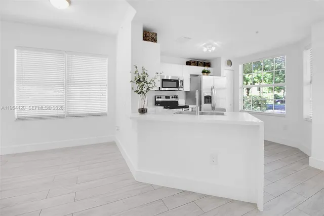 a view of kitchen with furniture and window
