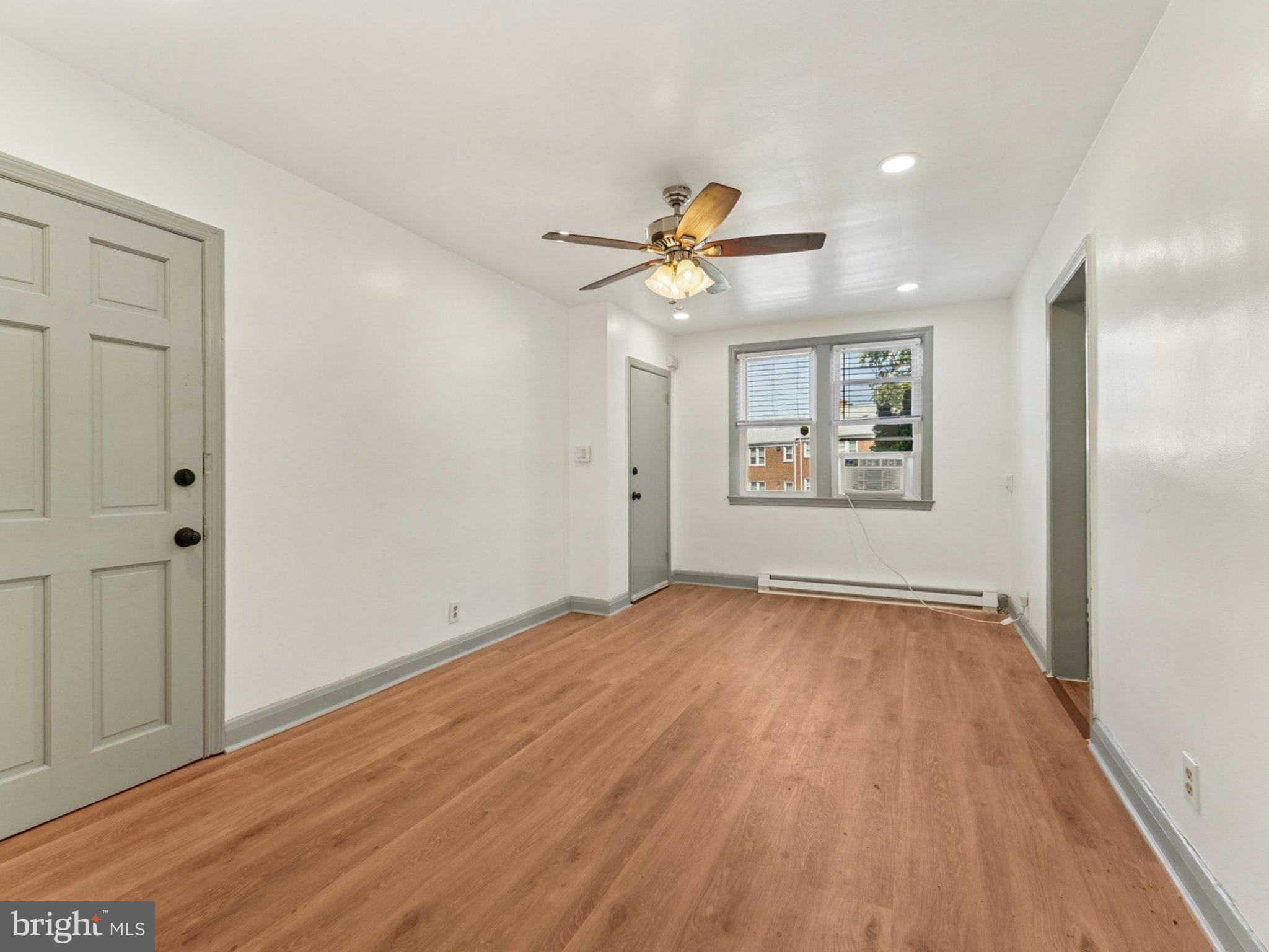 6123 MacBeth Drive Baltimore, MD 21239 - Photo 12 of 32 wooden floor in an empty room with a window