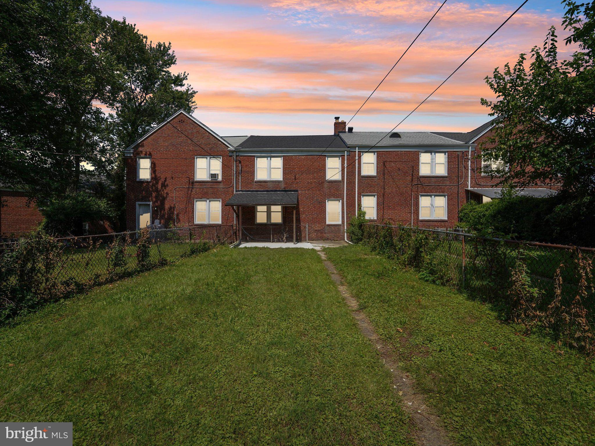 6123 MacBeth Drive Baltimore, MD 21239 - Photo 25 of 32 a front view of a house with garden