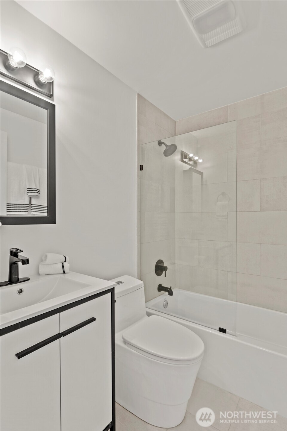 1300 University Street, Unit 2G Seattle, WA 98101 - Photo 17 of 28 a bathroom with a sink a toilet and shower