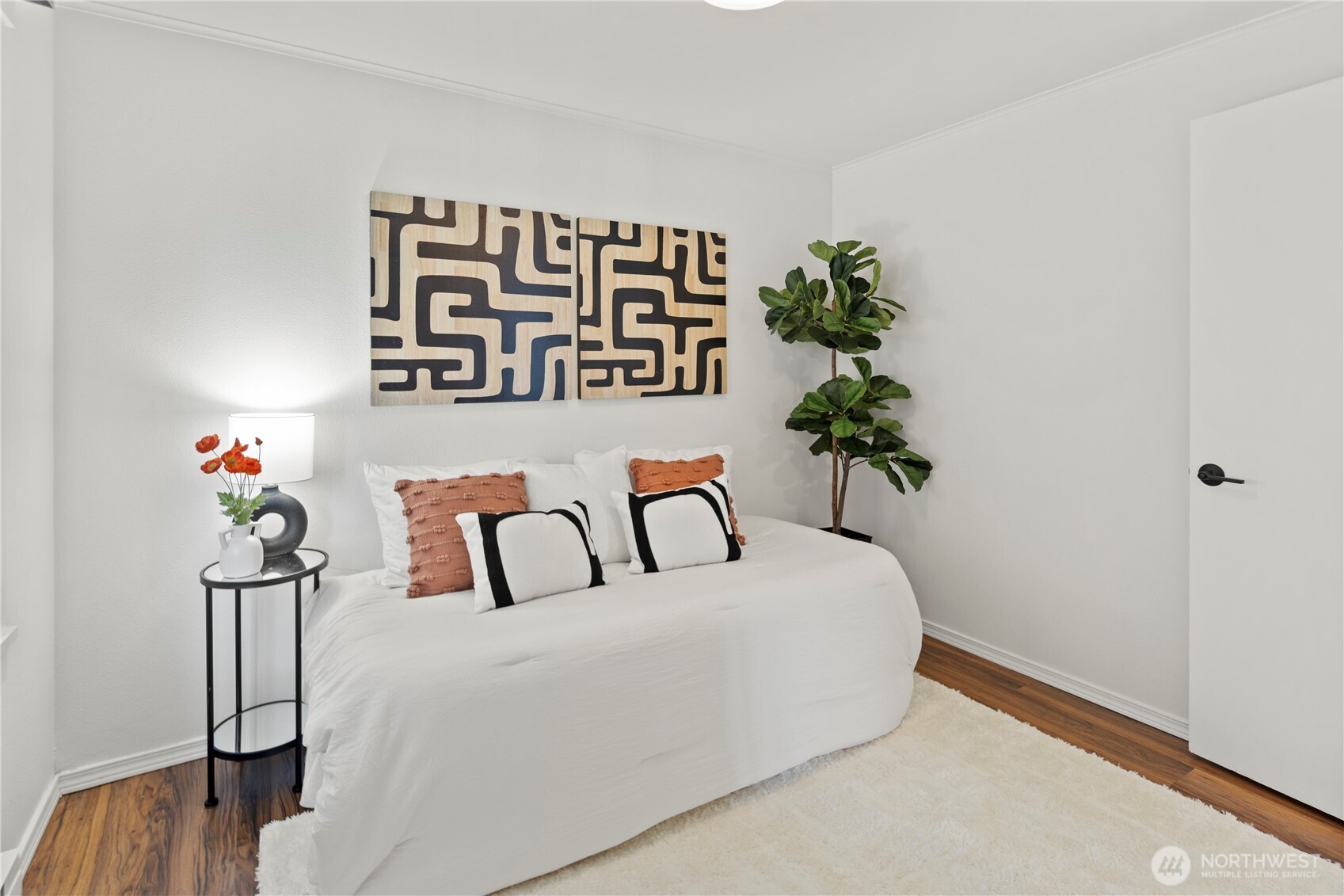 1300 University Street, Unit 2G Seattle, WA 98101 - Photo 18 of 28 a bedroom with a bed and a potted plant on th table