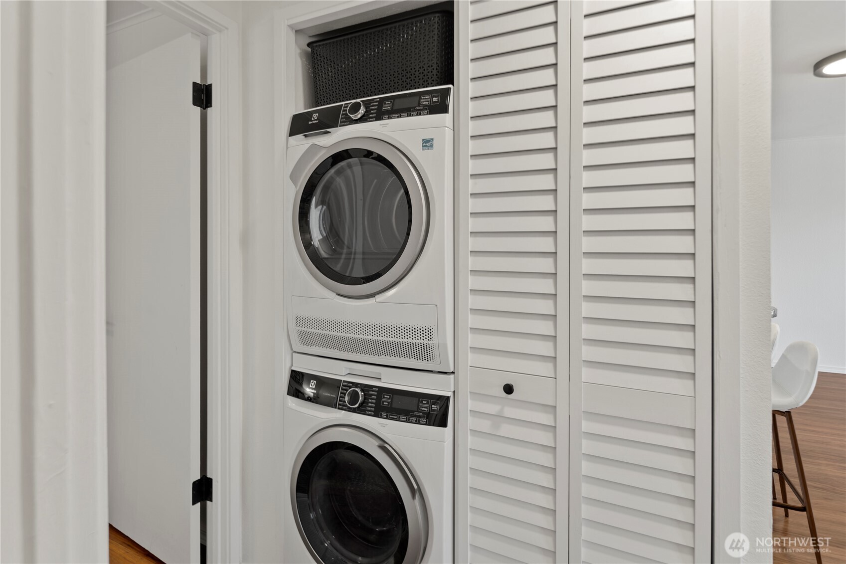 1300 University Street, Unit 2G Seattle, WA 98101 - Photo 21 of 28 a view of a hallway with washer and dryer