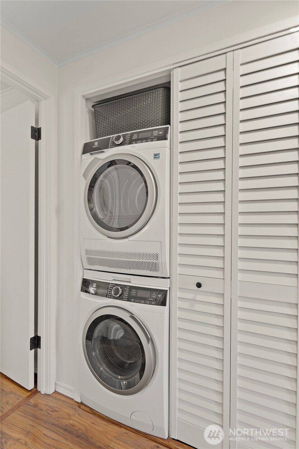 1300 University Street, Unit 2G Seattle, WA 98101 - Photo 22 of 28 a view of a bedroom with washer and dryer