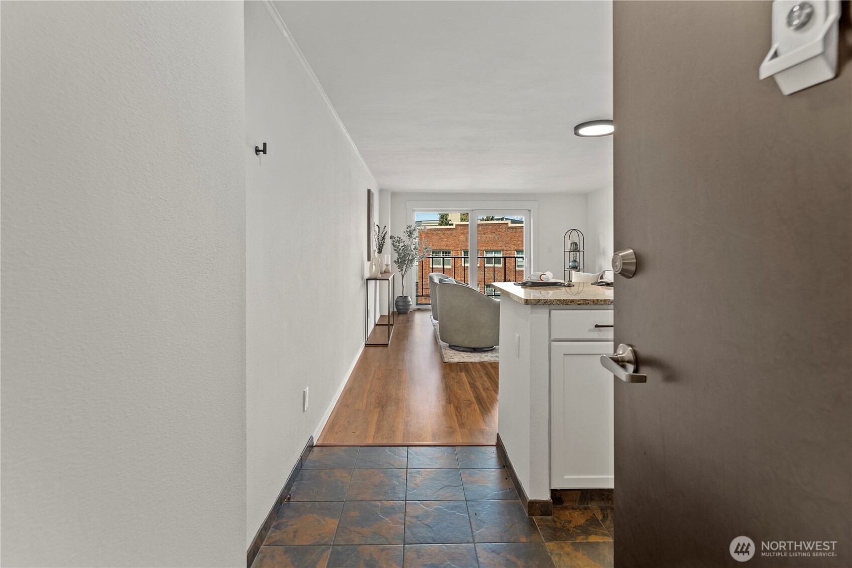 1300 University Street, Unit 2G Seattle, WA 98101 - Photo 27 of 28 a hallway with cabinets