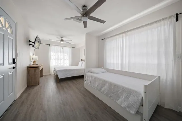 a bedroom with a bed and a window