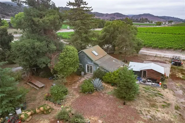 an aerial view of a house with a garden
