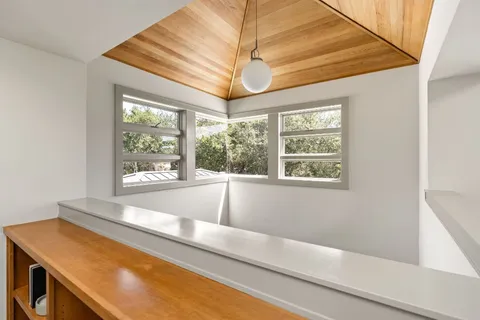 a view of a room with a large window