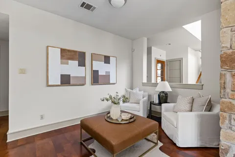 a living room with furniture and a table