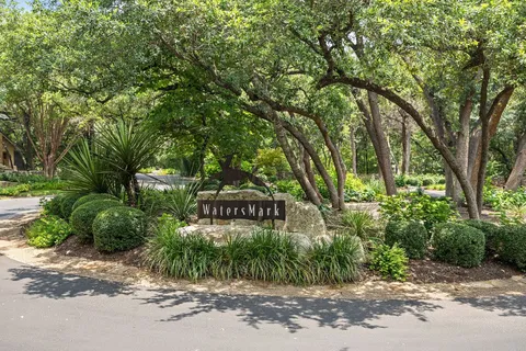 a front of a house with a tree