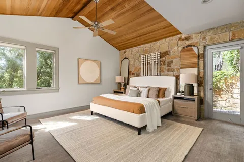 a bed room with a bed and a window