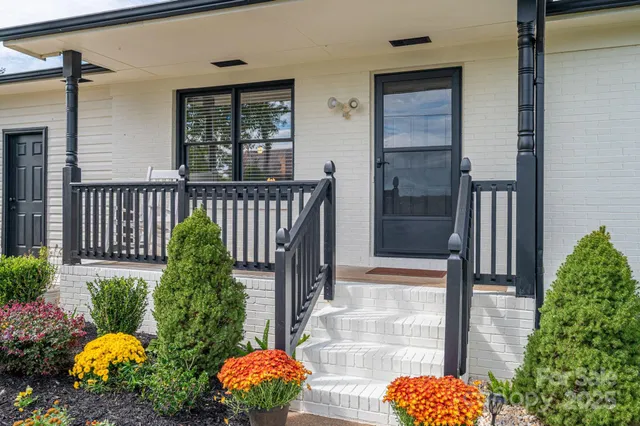a bunch of flowers in front of door