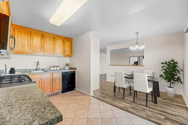 a kitchen with furniture and window