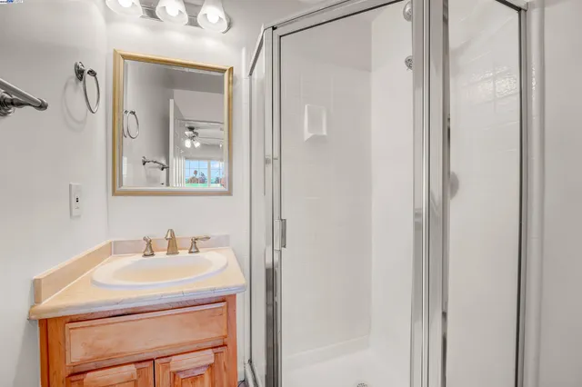a bathroom with a sink a vanity and a mirror