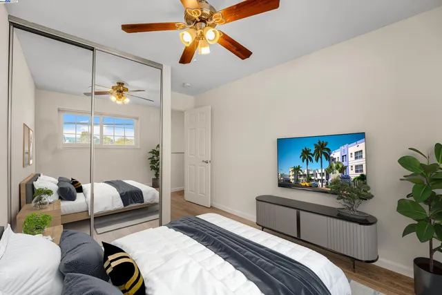 a bedroom with furniture and a chandelier