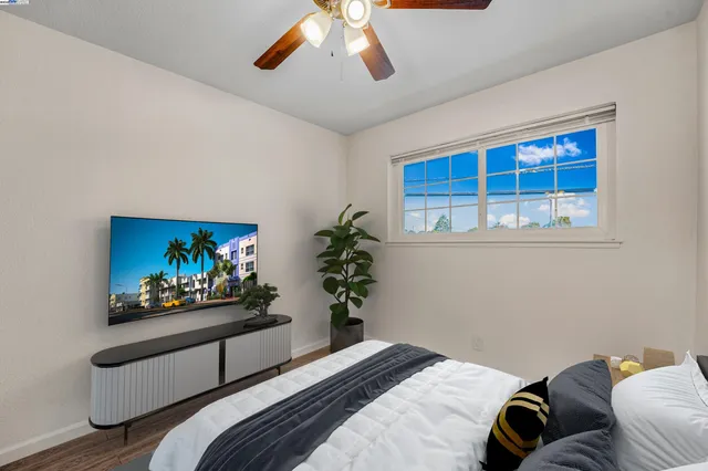 a bedroom with bed and a window