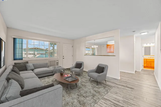 a living room with furniture and a large window